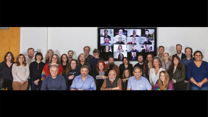 The members of the 2024 Editors Guild board (including Zoom attendees on-screen) pose on Jan. 6 with President Alan Heim, center.