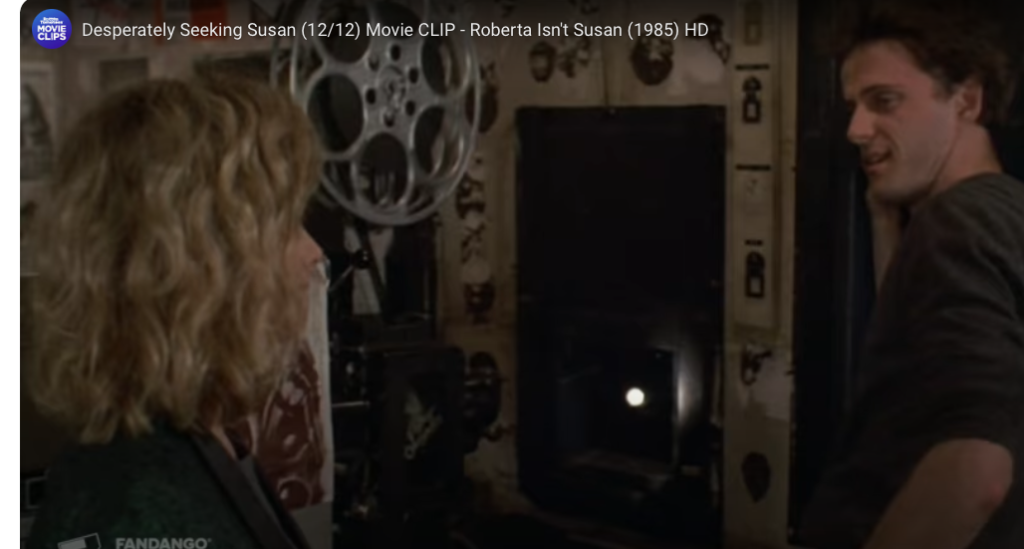 Aidan Quinn and Susanna Arquette in the projection room in DESPERATELY SEEKING SUSAN